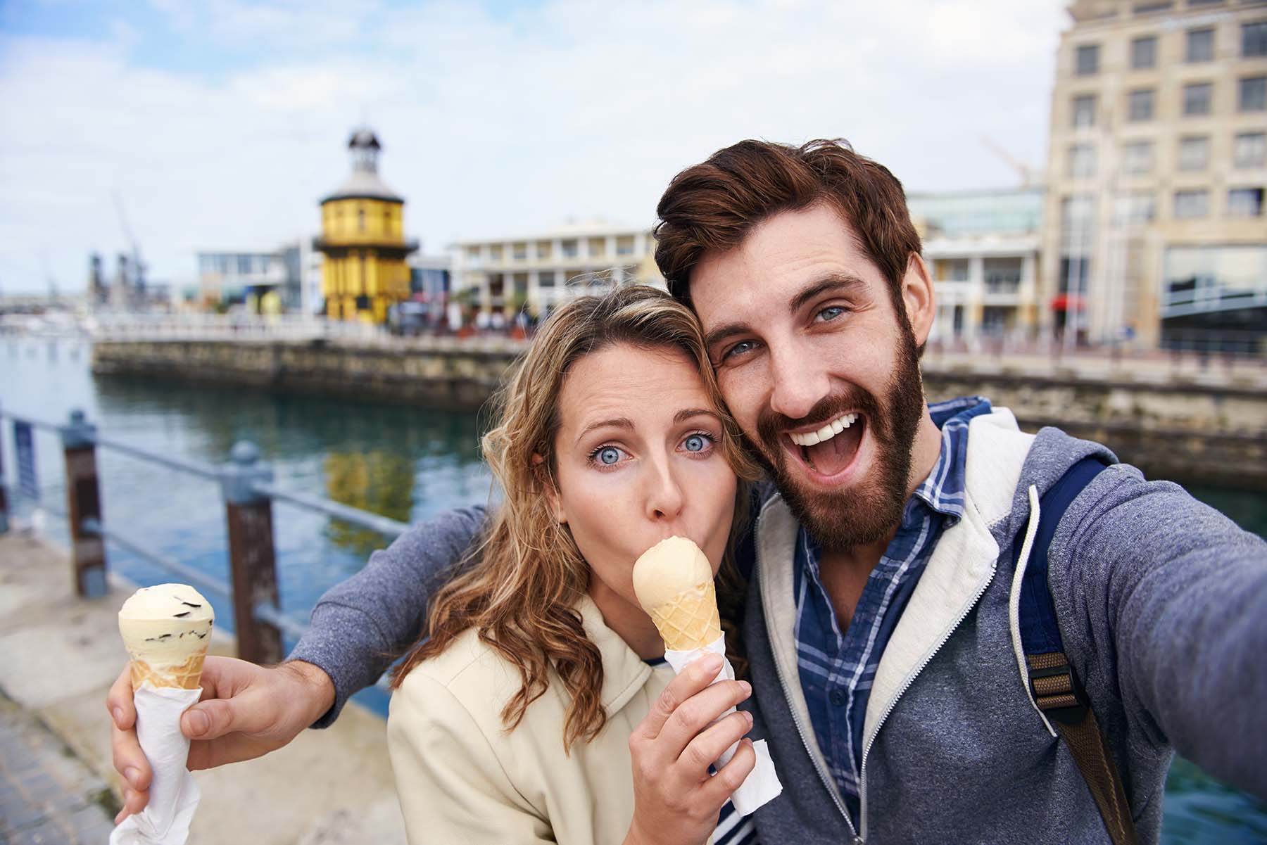 Couple eating ice cream. Vacation photo.