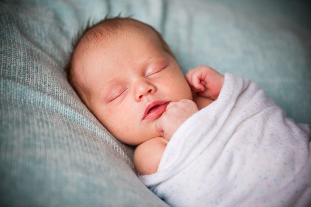 Content Baby swaddled properly