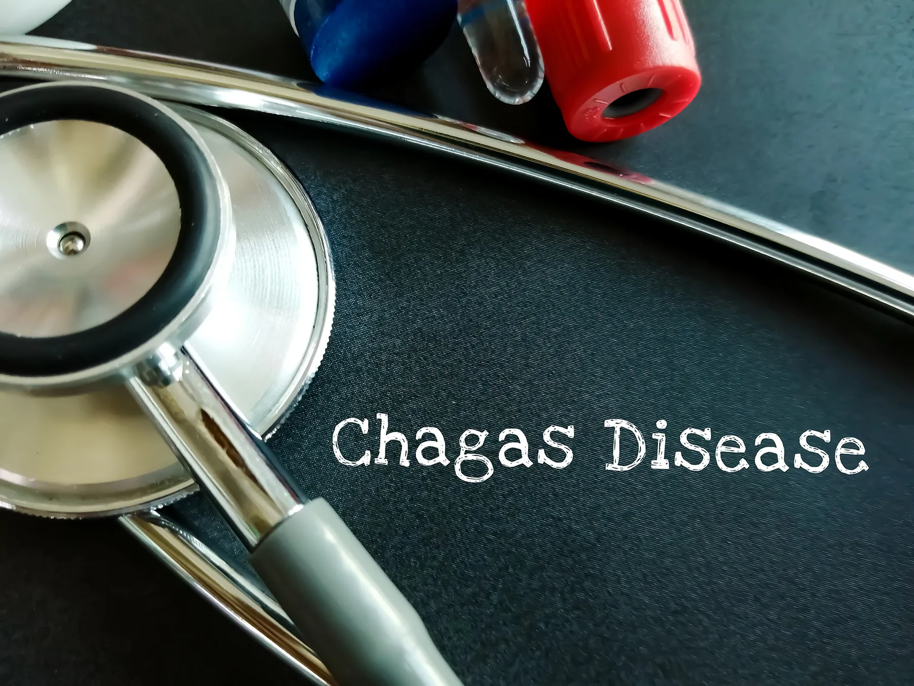 Stethoscope and blood collection tubes next to the text "Chagas Disease," symbolizing medical diagnosis and health awareness.