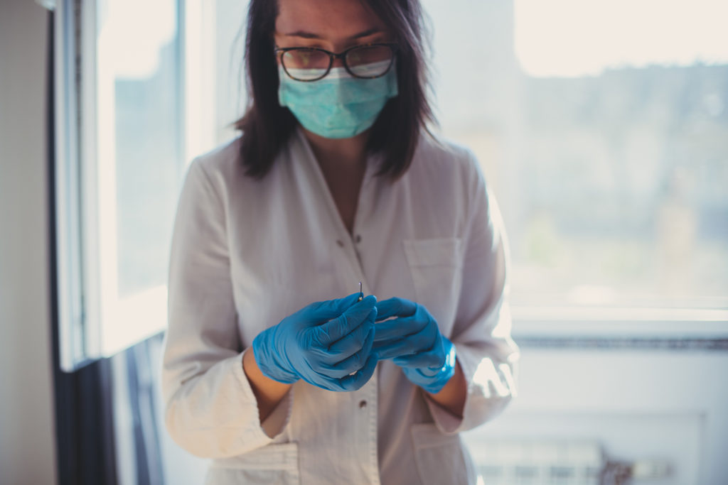 Woman's hand with a syringe
