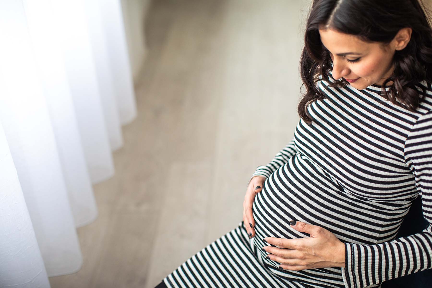 Pregnant woman in striped dress