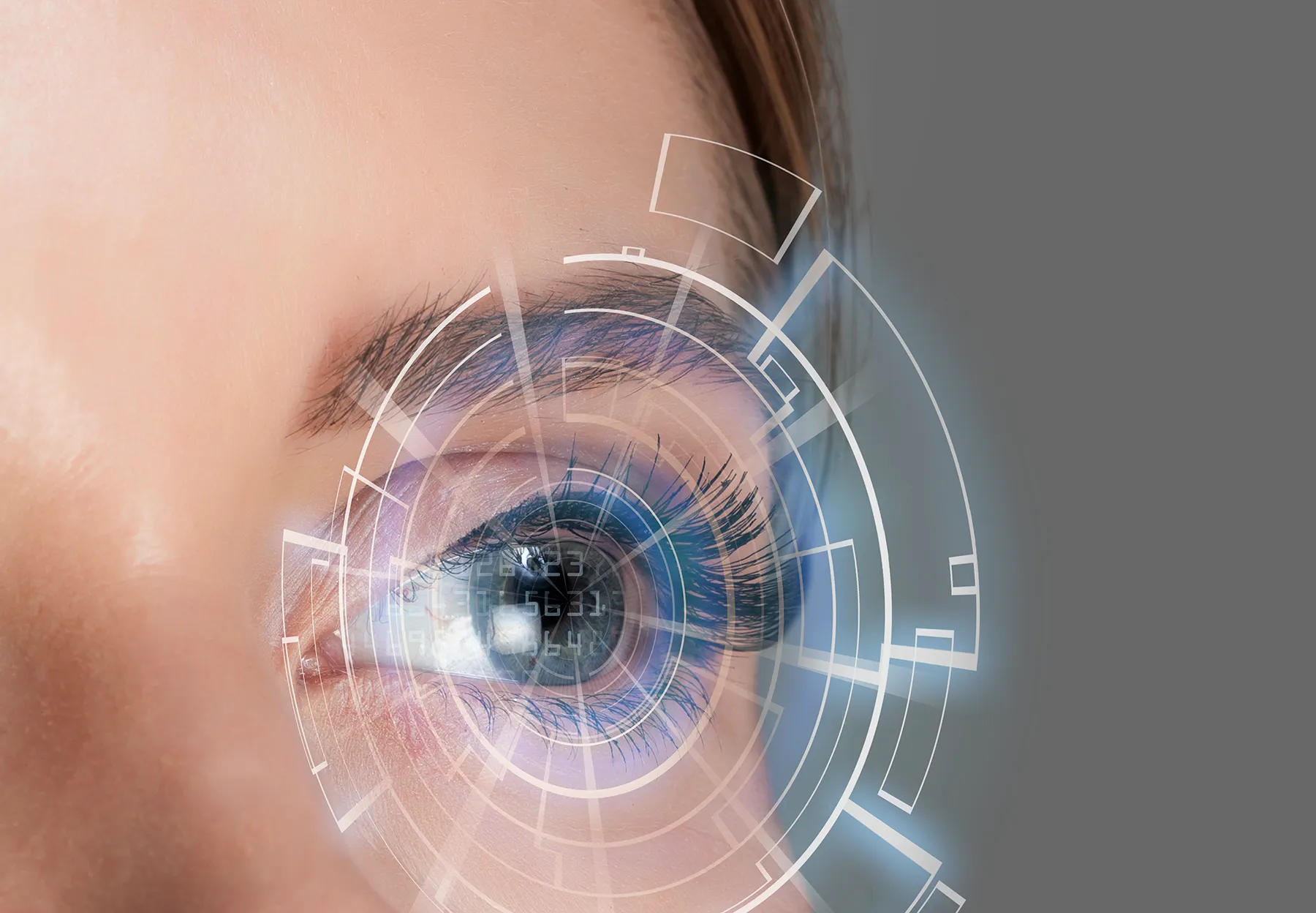 Close-up of a human eye with a futuristic augmented reality (AR) digital overlay, indicative of biometric scanning.