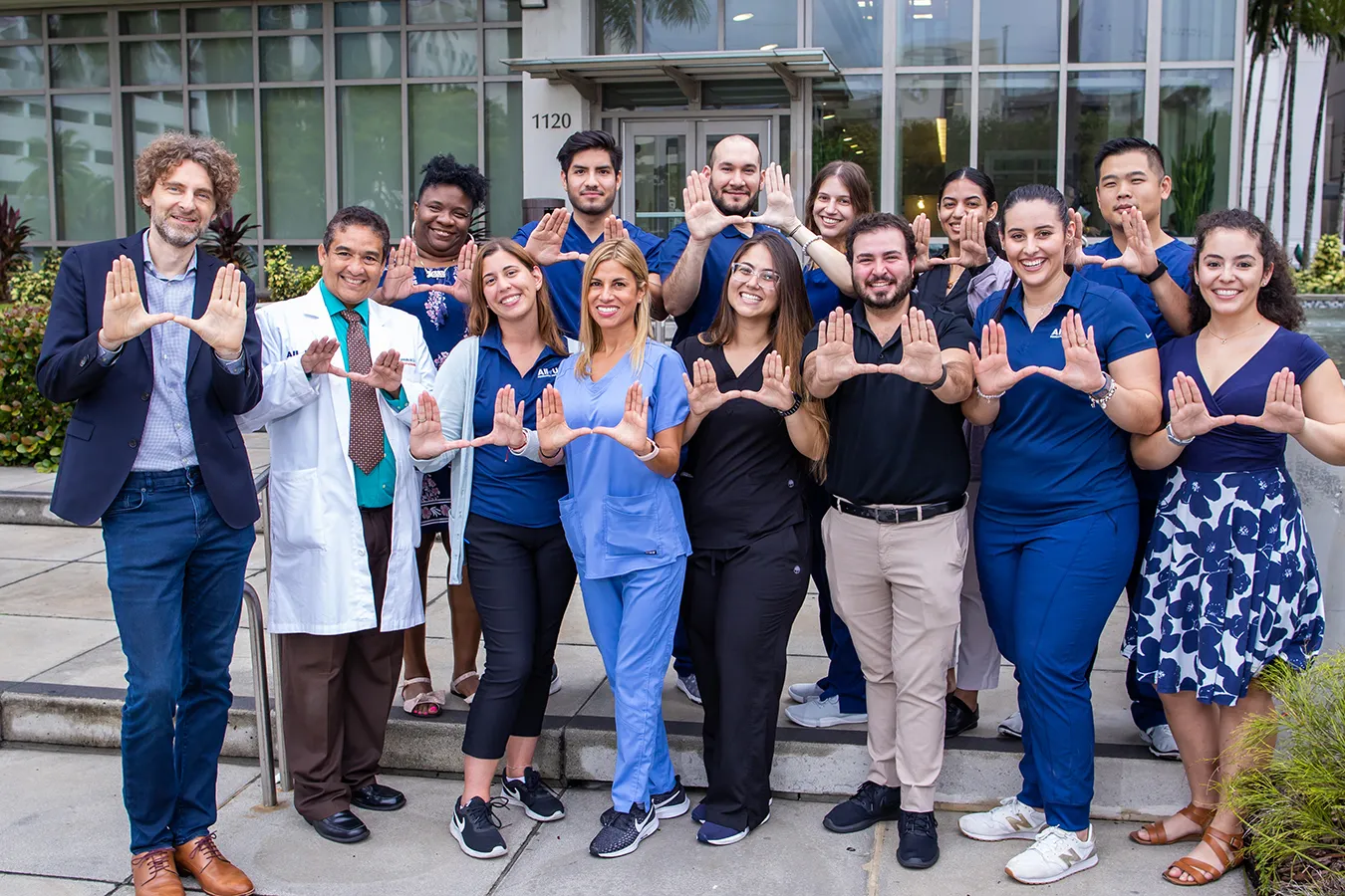Dr. Stephan Z√ºchner, a geneticist and researcher from the University of Miami Miller School of Medicine, wearing a lab coat with the UHealth logo.