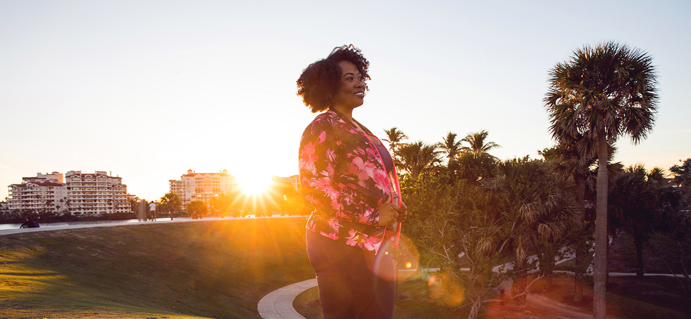 Black woman enjoying a walk at sunrise or sunset