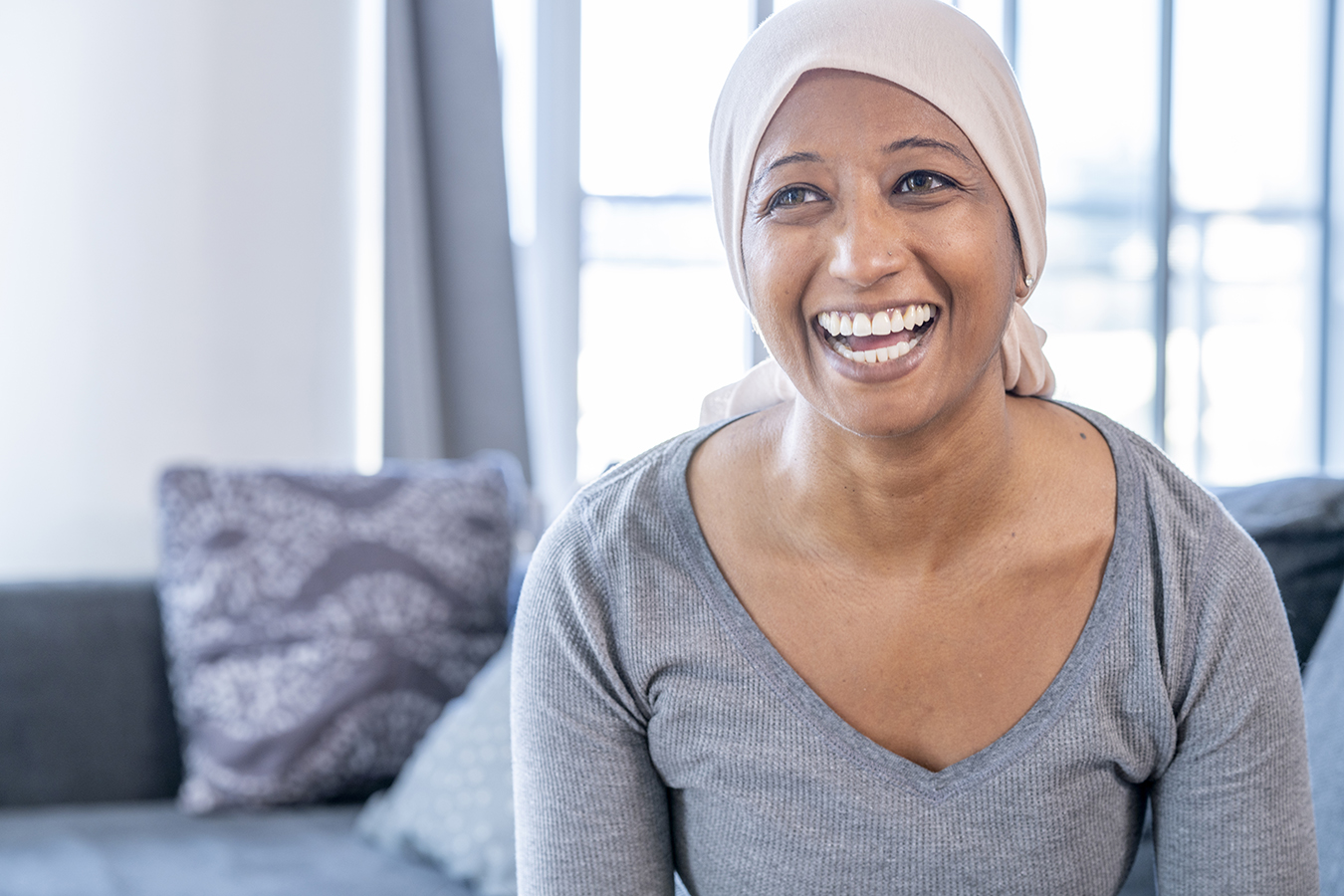 Woman with triple negative breast cancer smiles for the camera