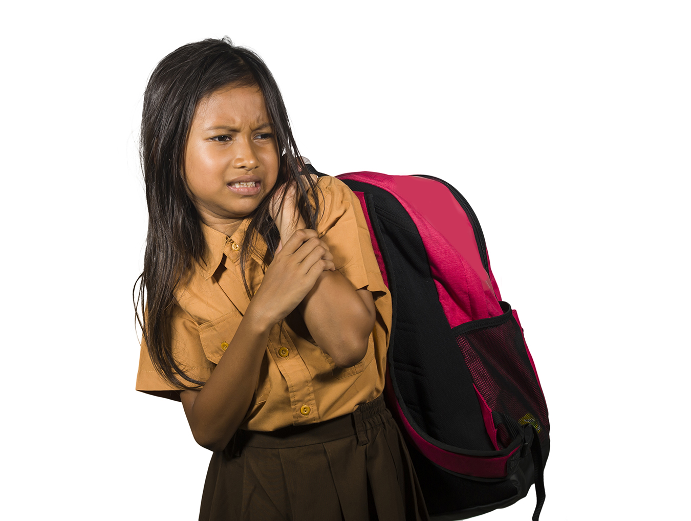 Young girl carrying a backpack that is too heavy and causing back pain.