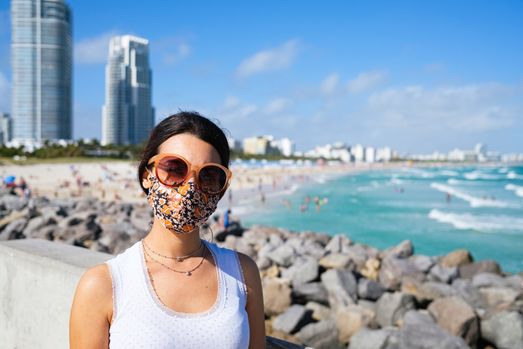 Young woman in camisol on beach in Miami