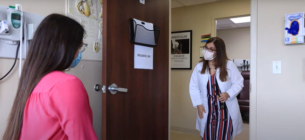 Dr. Delgado enters hypertension patient room