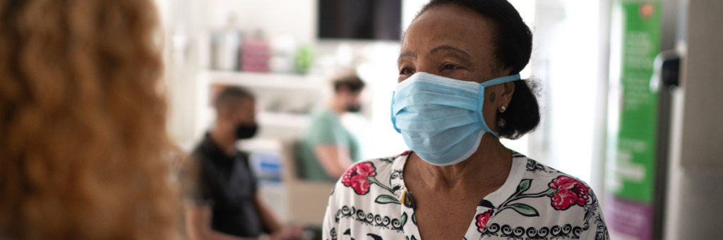 Woman patient checking in for lung cancer screening.