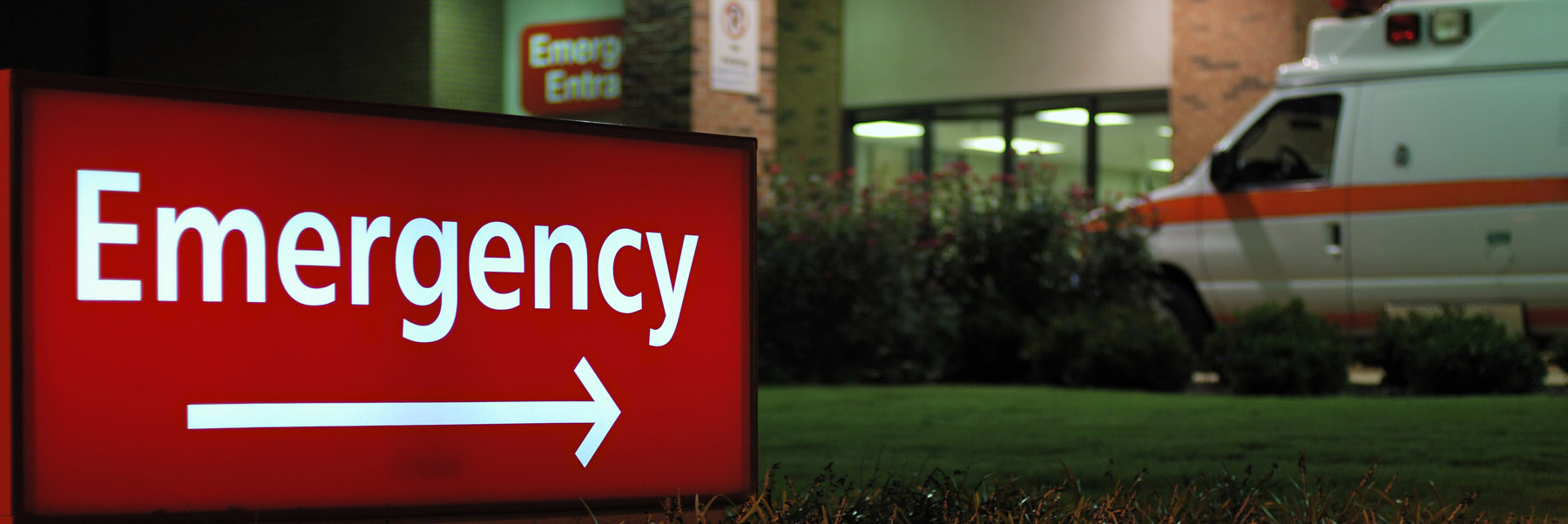Emergency sign points to a hospital entrance