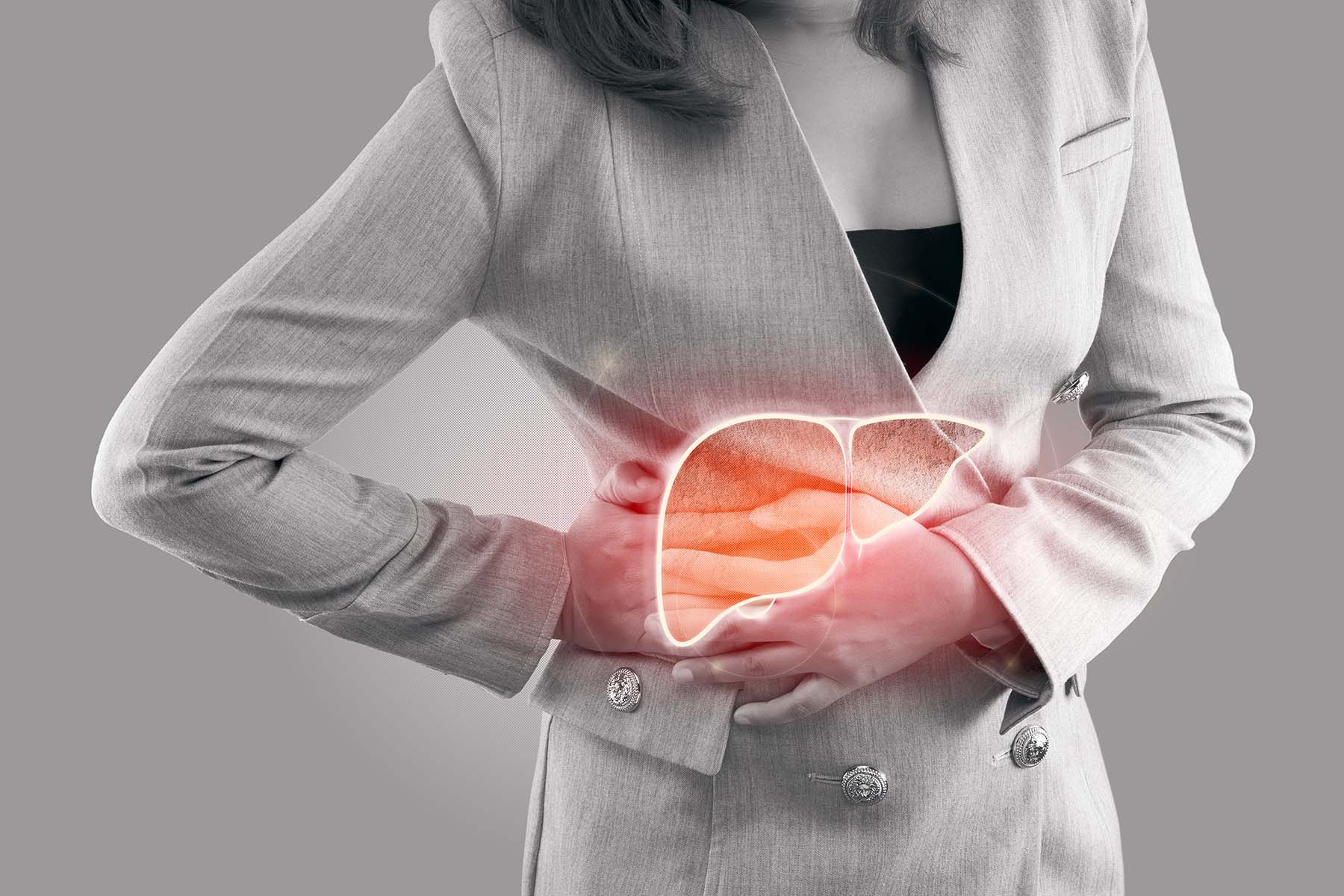 Grayed out image of woman in business suit with graphic of her liver being a source of pain.
