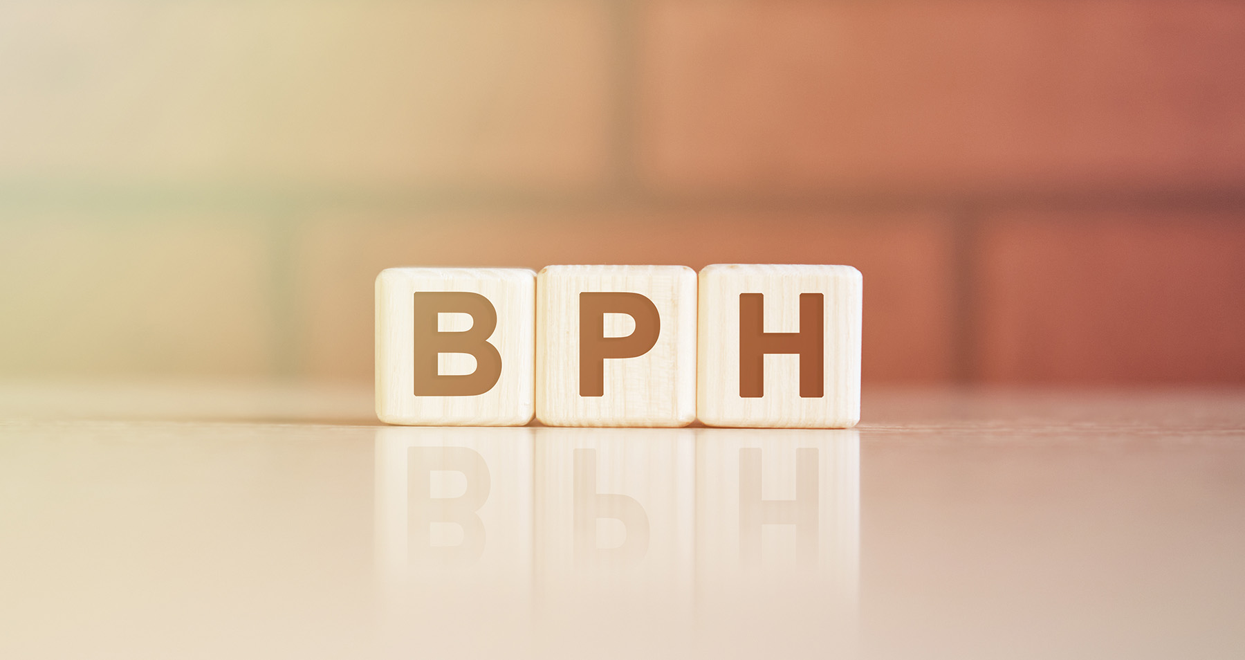 Graphic of BPH on letter blocks on a faded background.