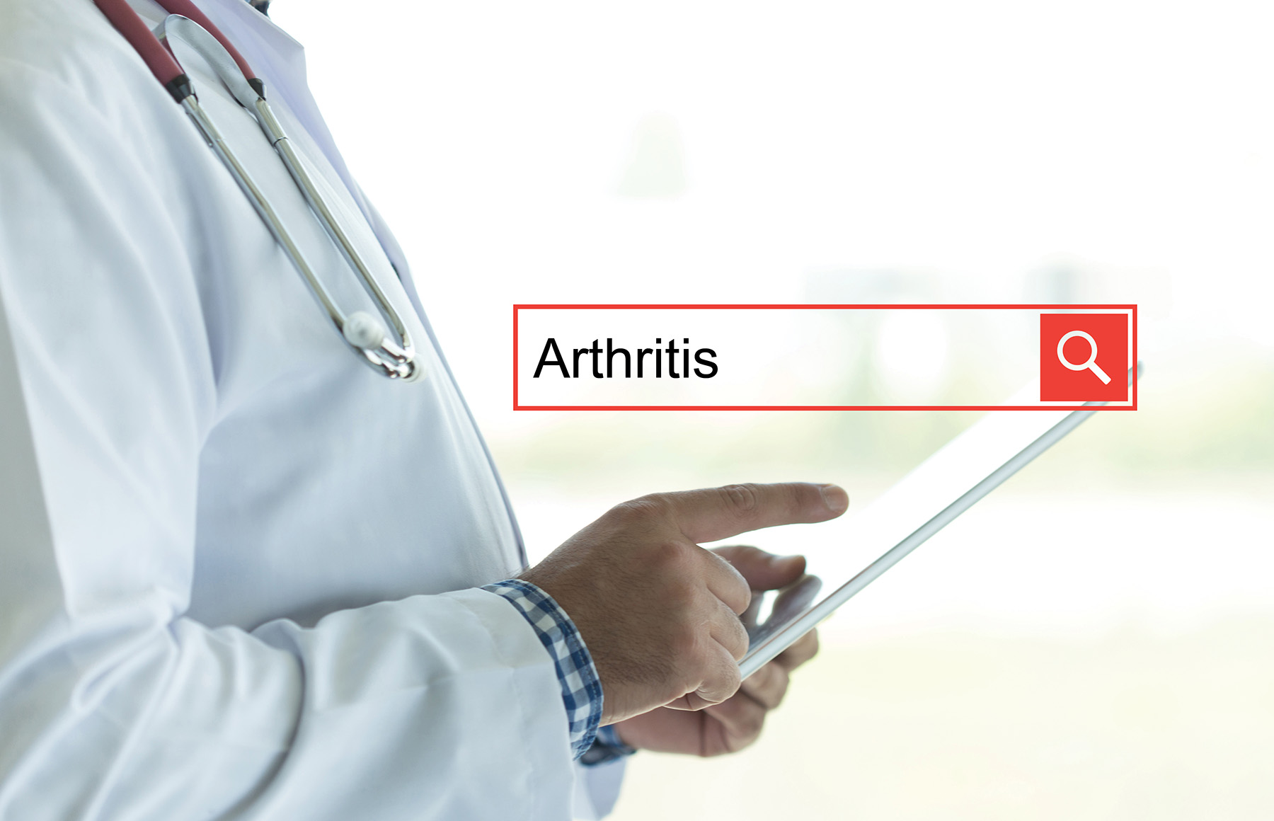 Online search bar with arthritis typed in. Doctor on tablet in background.