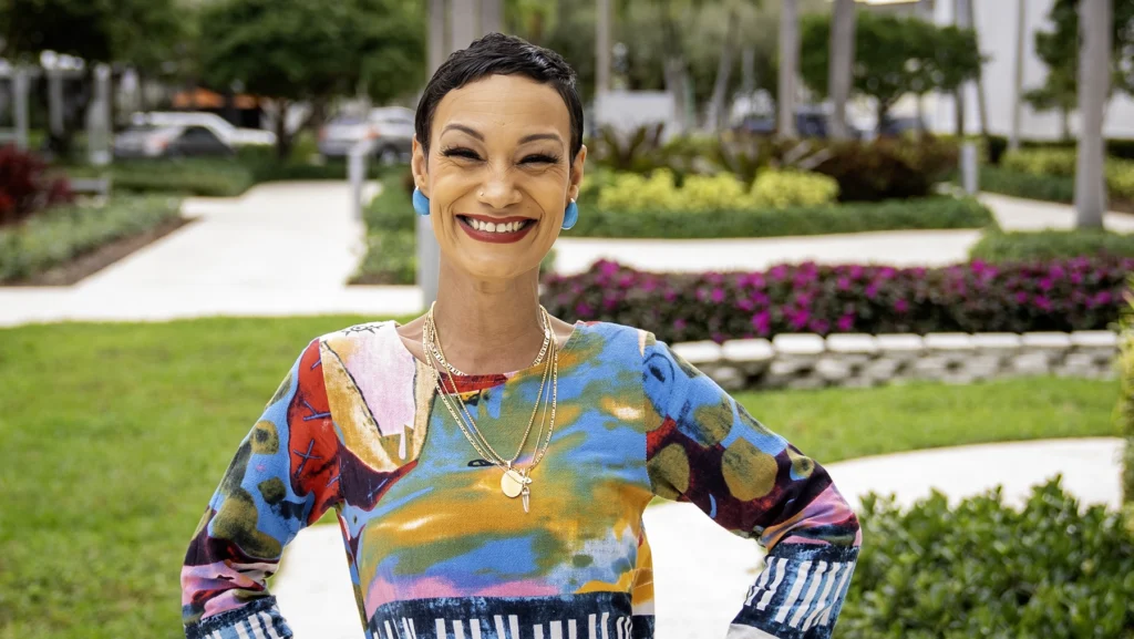 Smiling Jasmine Santiago, patient at Sylvester Cancer in Miami, takes part in the Look Good, Feel Better workshop.