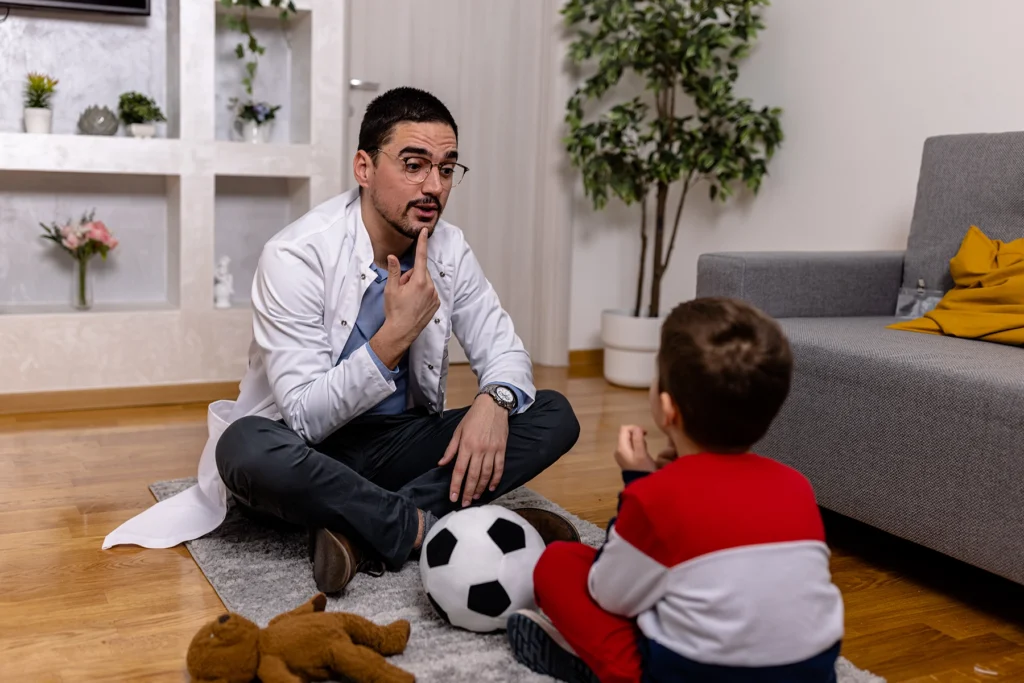 Speech therapist helps boy with Fragile X syndrome.