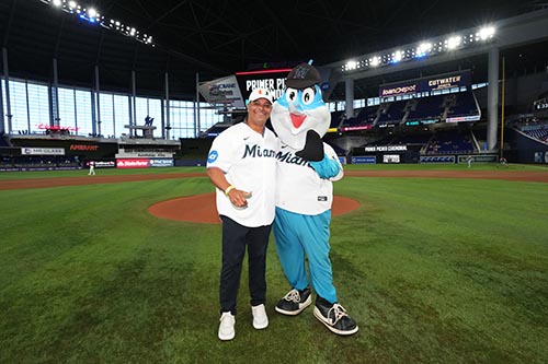 Sylvester Cancer patient Mervyl Melendez with the Florida Marlins mascot, Billy the Marlin.