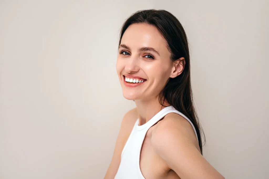 Smiling woman with smooth skin.