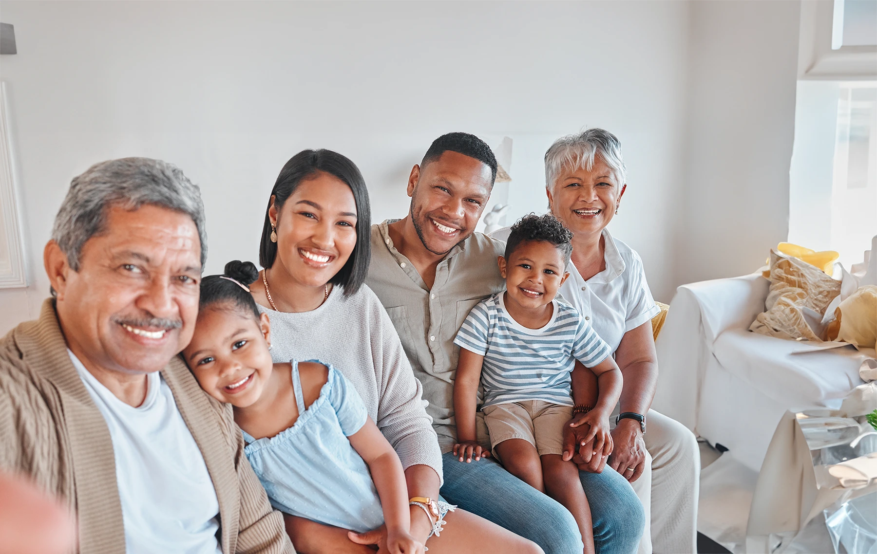 Happy Hispanic family, featured in a story about genetics and cancer risk