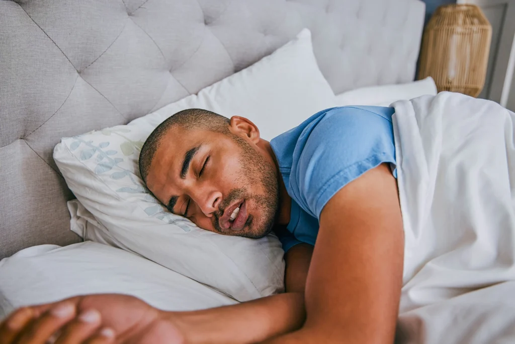 Handsome Hispanic man obviously getting restful sleep.