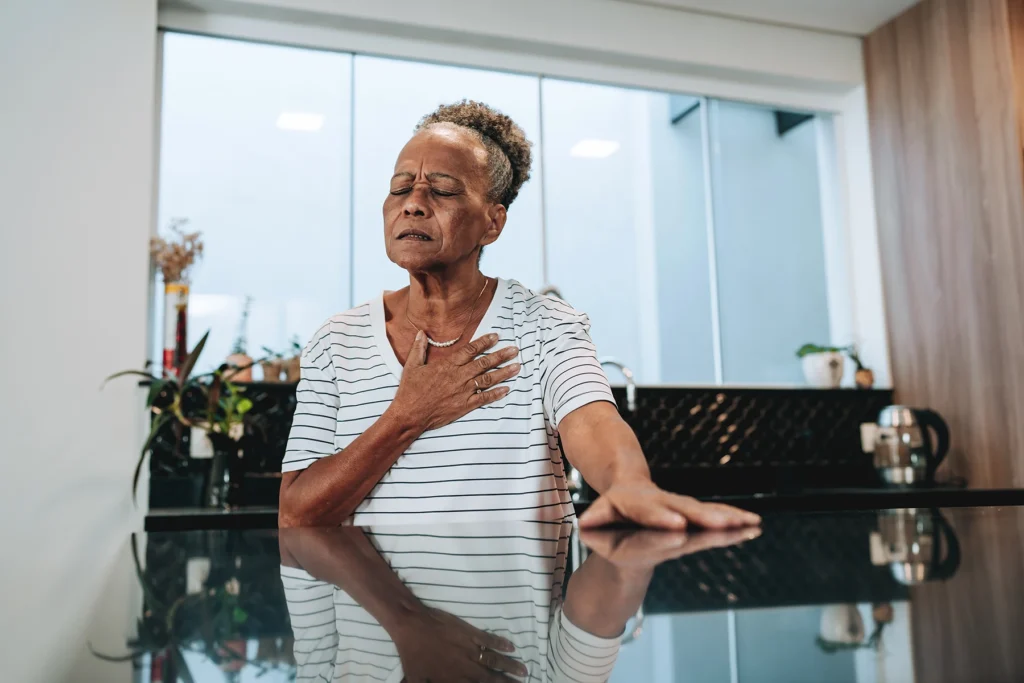 Older Hispanic woman is concerned by a irregular heartbeat.