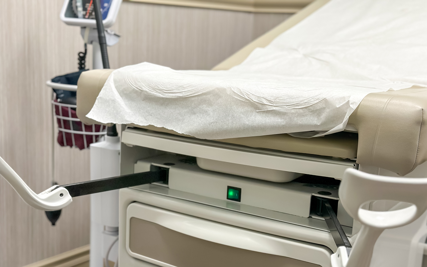 An empty gynecologic examination table