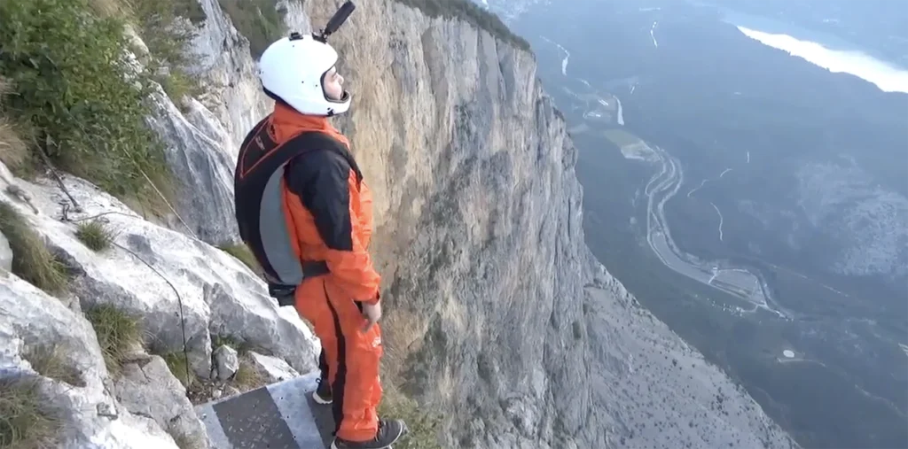 Pancreatic cancer survivor Manuel Garcia prepares to base jump.