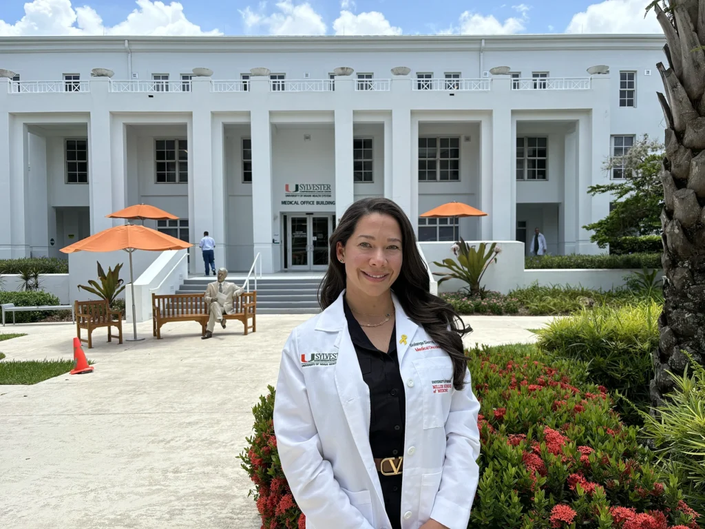 Solange Sierra, APRN, stands in the Sylvester courtyard.