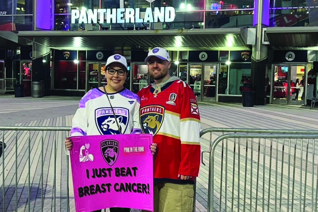 A cancer survivor and her husband stand outside Amerant Arena in Sunrise, FL, after a Panthers game.