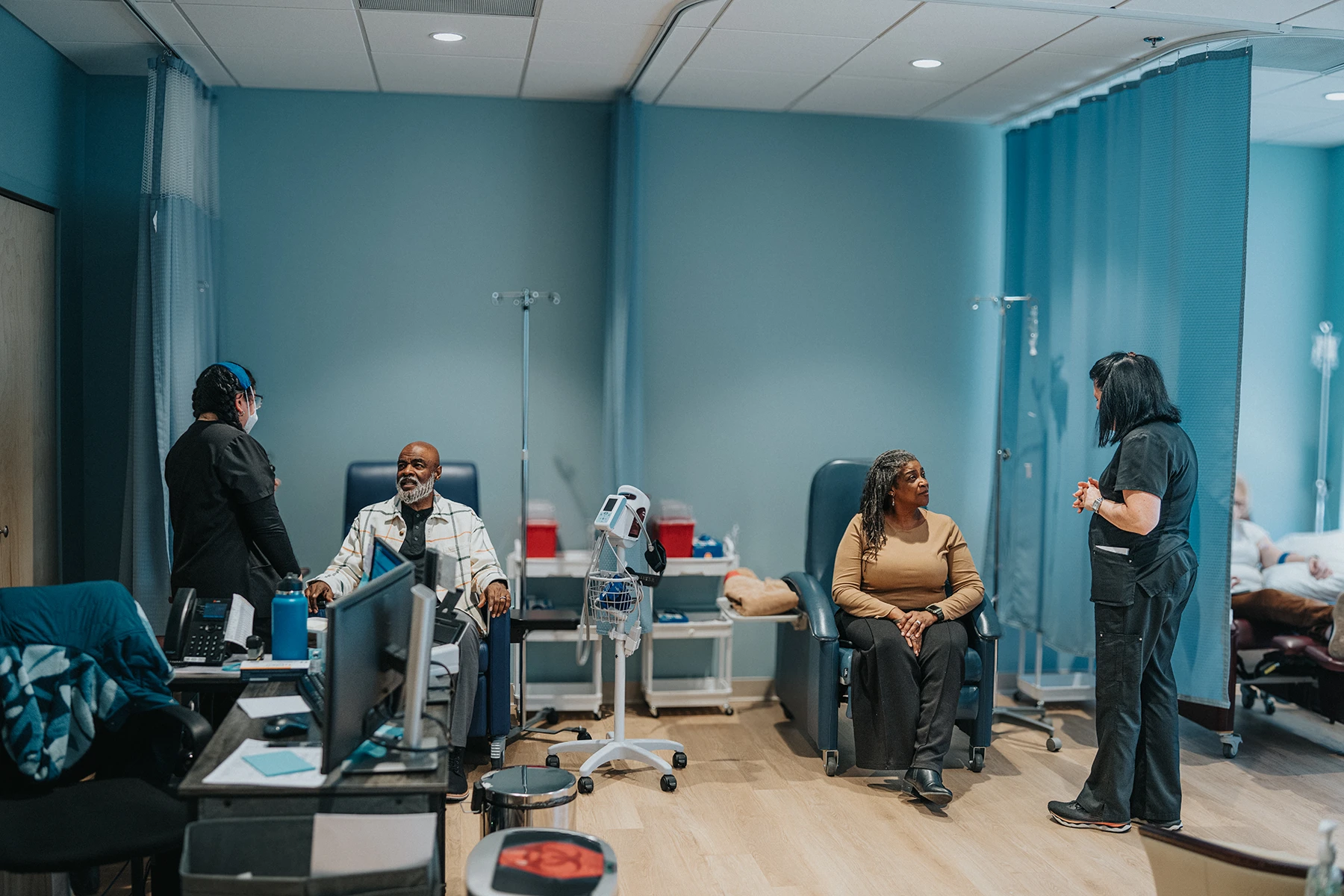 Getty image of people at cancer clinical trial getting treatment.