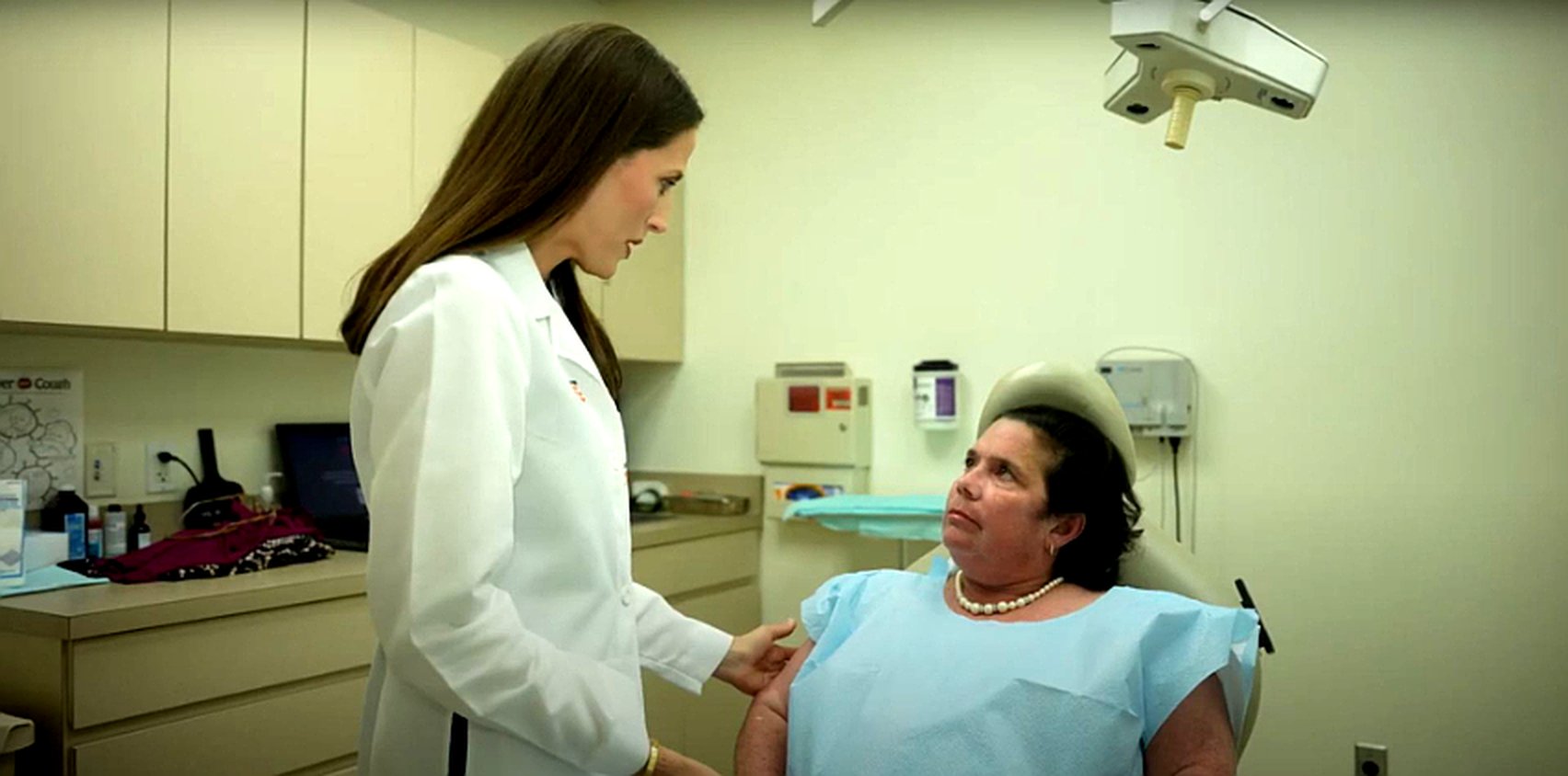 Dermatologist examining a patient with lupus.