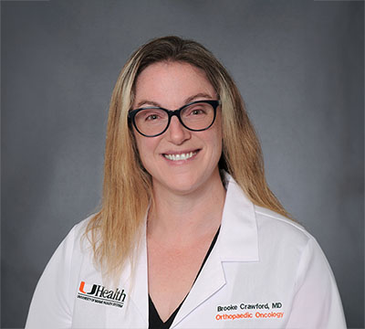 Dr. Brooke Crawford in white clinic coat