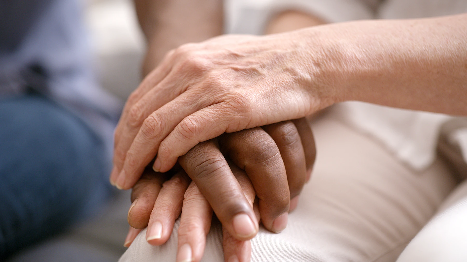 Close-up of hands clasping each other