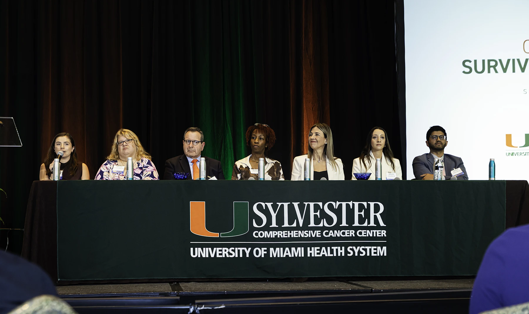 Oncologists at Sylvester sit on a panel discussion dais during the Survivorship symposium in Oct. 2025