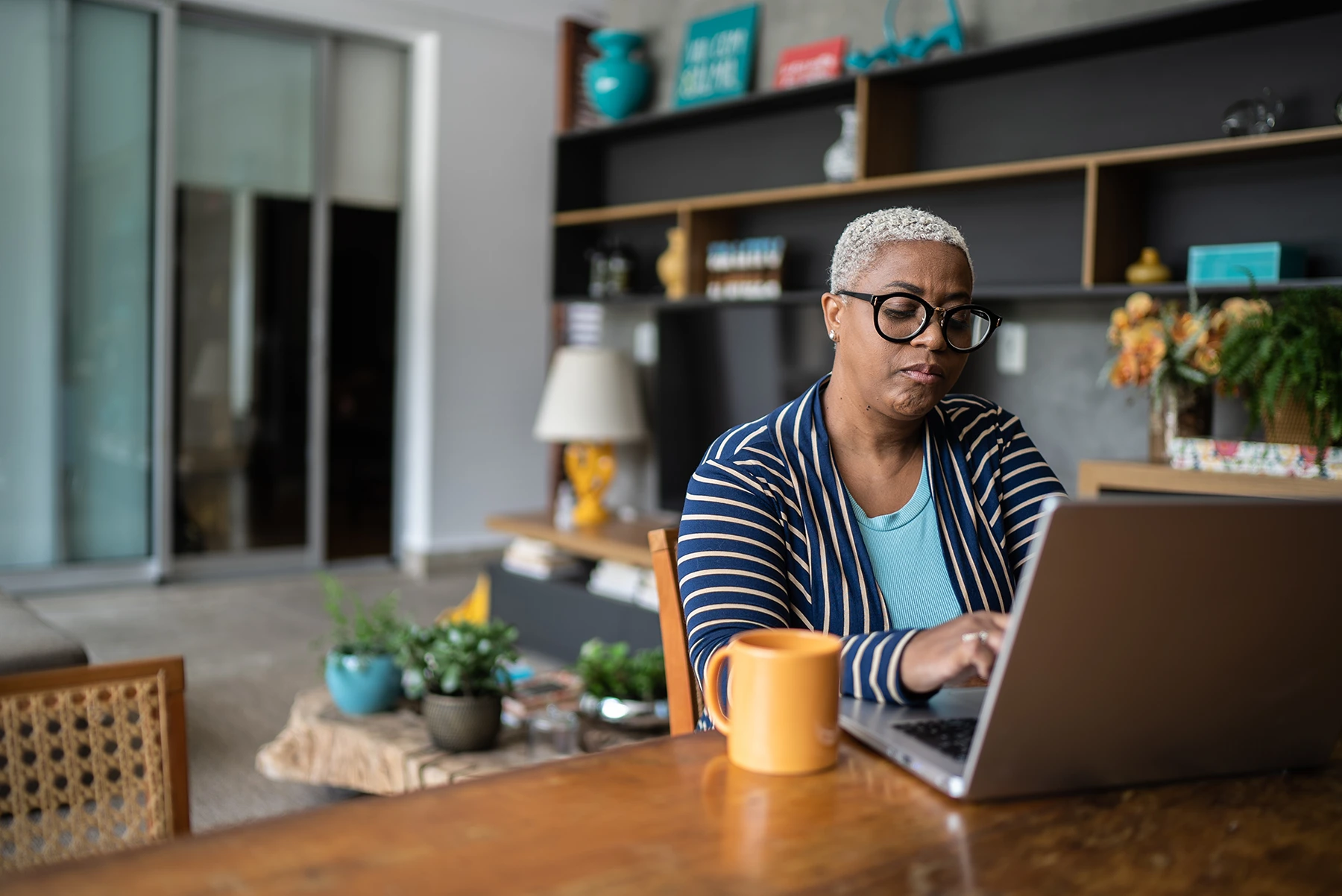 Mature Black woman working on computer. Stock image