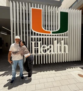Kristina Ruiz in front of UHealth logo