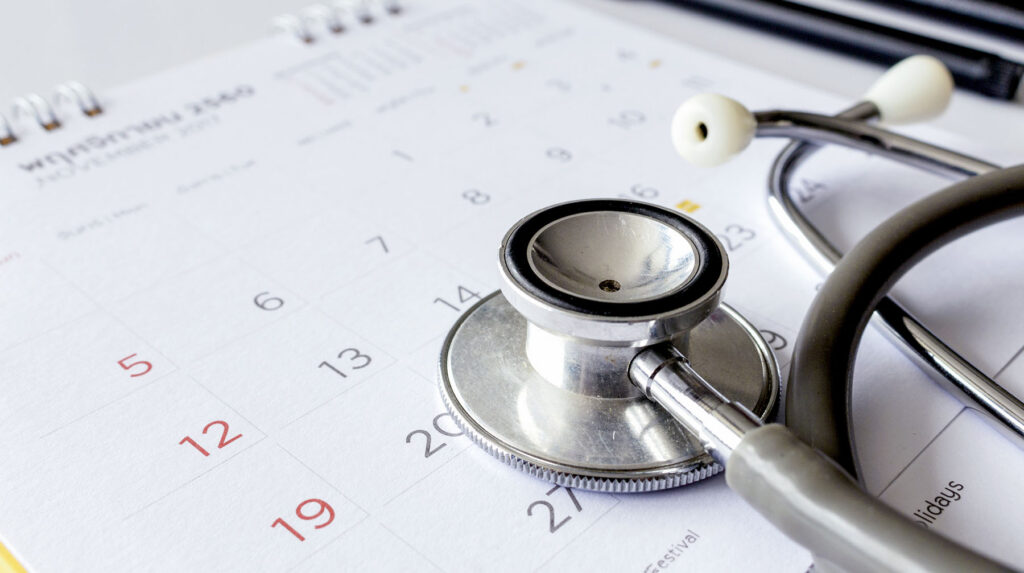 annual checkup concept. stethoscope on the calendar with soft-focus and over light in the background
