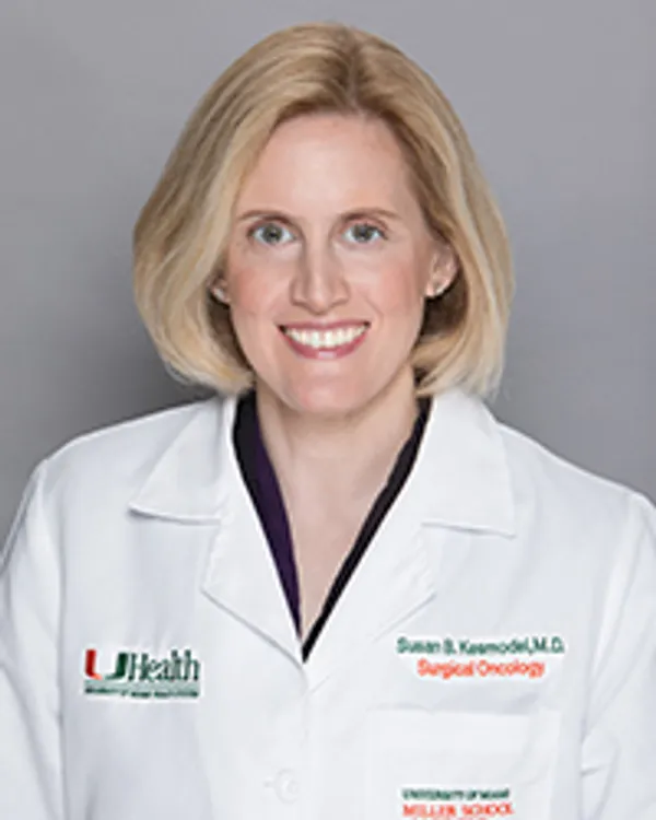 Dr. Susan Kesmodel, smiling in her white clinic coat